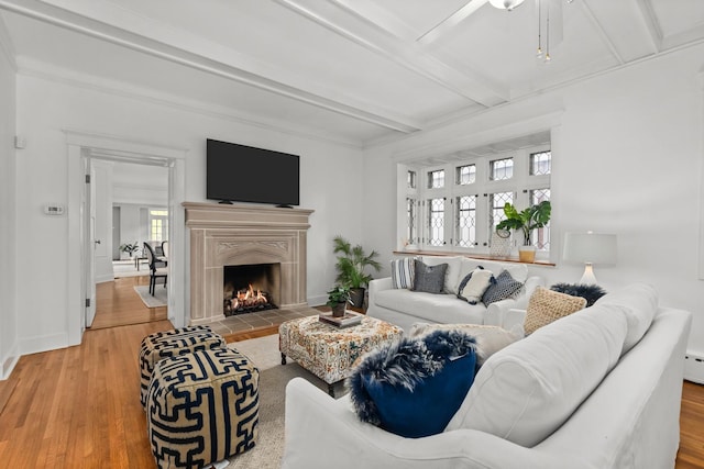 714 Sheridan Rd, Evanston, IL 60202 - living room featuring beam ceiling, wood finished floors, a ceiling fan, a fireplace, and baseboards