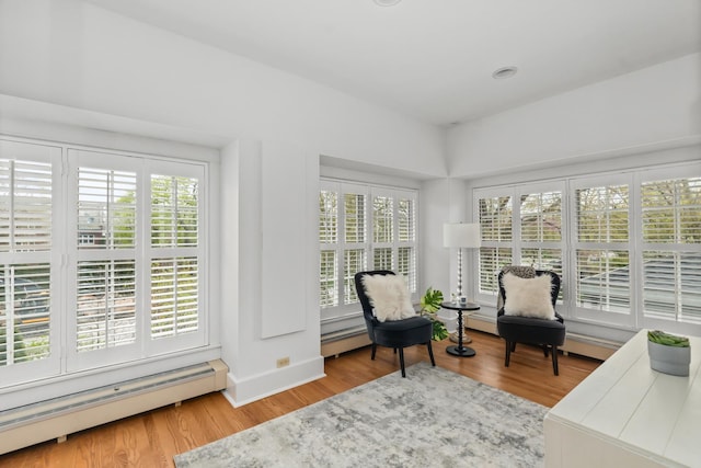 714 Sheridan Rd, Evanston, IL 60202 - sitting room featuring a baseboard radiator, healthy amount of natural light, and wood finished floors