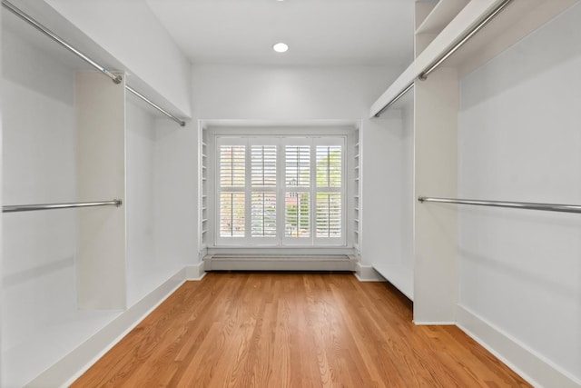 714 Sheridan Rd, Evanston, IL 60202 - walk in closet featuring a baseboard heating unit and light wood-style floors