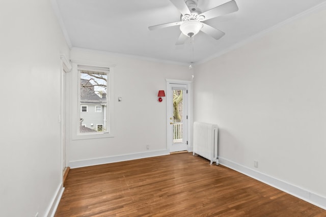 714 Sheridan Rd, Evanston, IL 60202 - spare room featuring radiator, crown molding, wood finished floors, ceiling fan, and baseboards