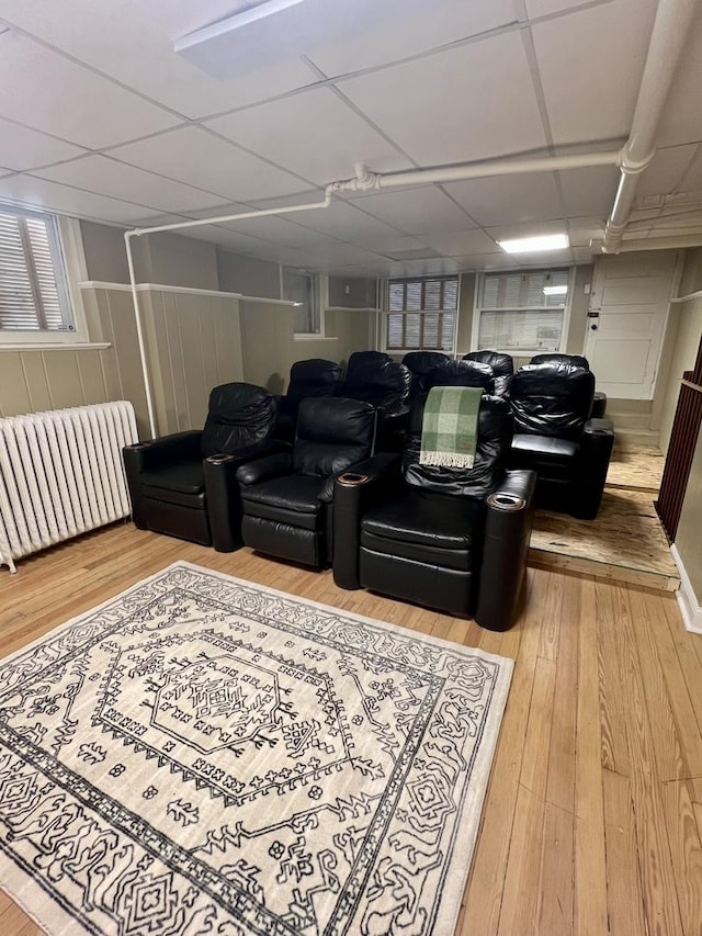 714 Sheridan Rd, Evanston, IL 60202 - cinema with radiator heating unit, wood finished floors, and a paneled ceiling