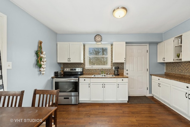 kitchen with white cabinets, stainless steel range with electric stovetop, open shelves, and a sink