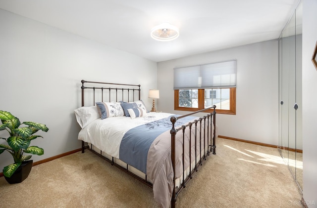bedroom featuring carpet flooring and baseboards