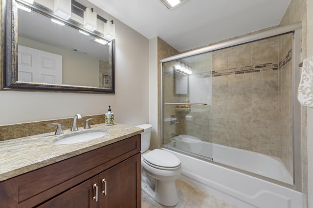 bathroom featuring enclosed tub / shower combo, tile patterned flooring, toilet, vanity, and visible vents