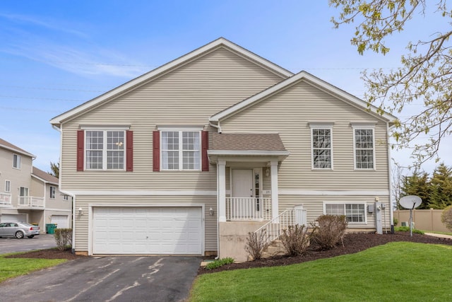 3531 Woodside Ct, Joliet, IL 60431 - raised ranch with an attached garage, a front lawn, and aphalt driveway