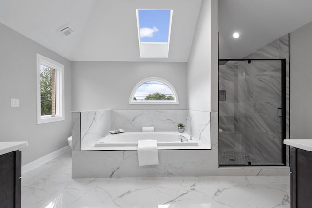 bathroom with marble finish floor, a healthy amount of sunlight, vanity, and a marble finish shower