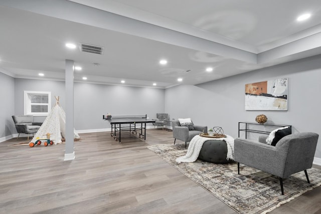 living room featuring wood finished floors, visible vents, and recessed lighting