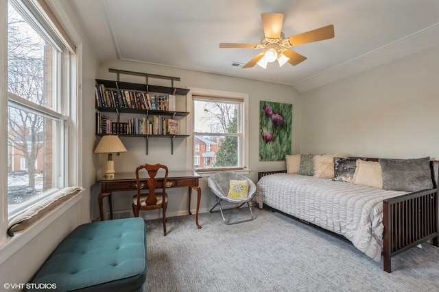 bedroom with visible vents, baseboards, a ceiling fan, carpet, and vaulted ceiling