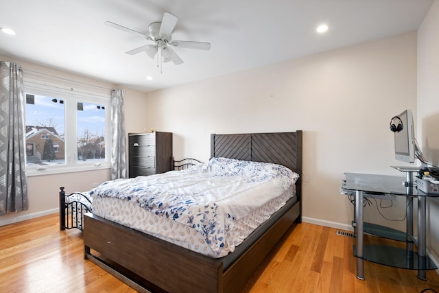 bedroom featuring light wood-style floors, ceiling fan, baseboards, and recessed lighting