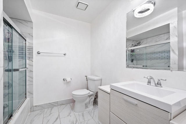 bathroom with marble finish floor, toilet, enclosed tub / shower combo, vanity, and baseboards