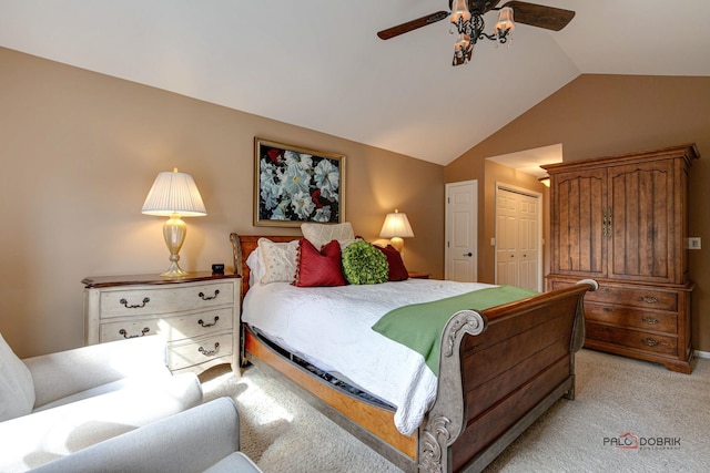 bedroom with lofted ceiling, a closet, light carpet, and ceiling fan