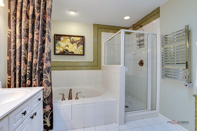 bathroom featuring a garden tub, radiator heating unit, a shower stall, and vanity