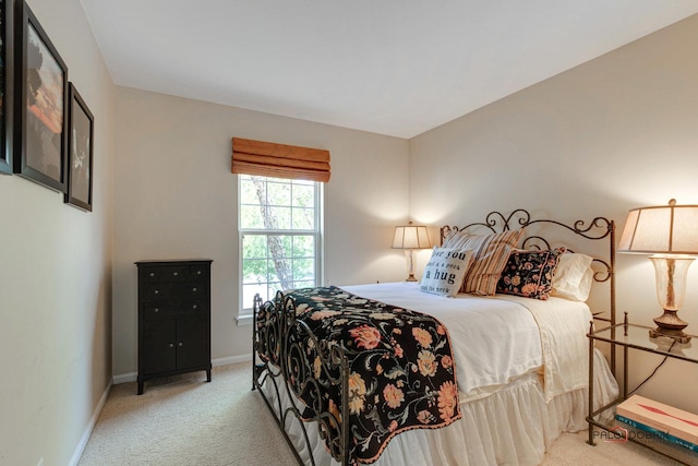 carpeted bedroom with baseboards