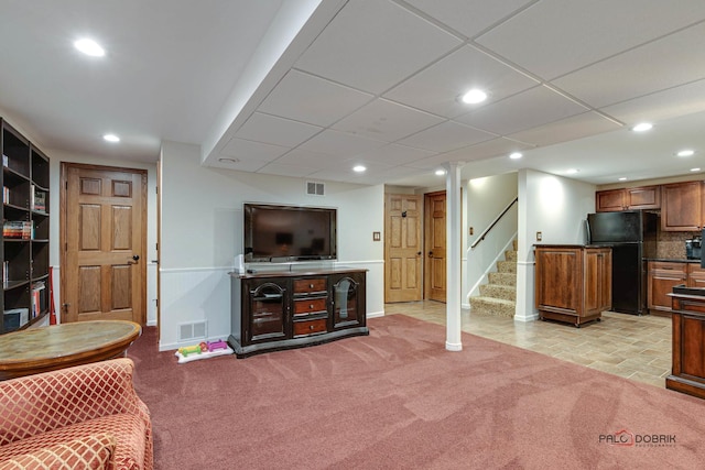 living area featuring light carpet, stairway, visible vents, and recessed lighting