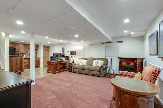 living area featuring recessed lighting, light colored carpet, and a fireplace