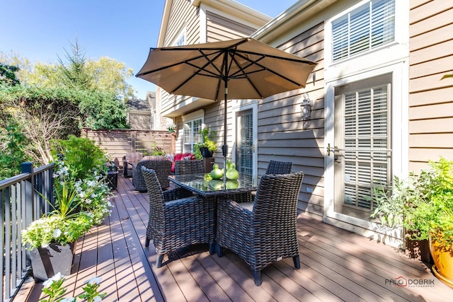 deck featuring outdoor dining area