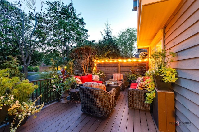 wooden deck featuring an outdoor hangout area