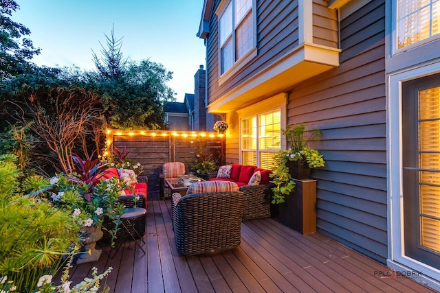 wooden deck featuring outdoor lounge area