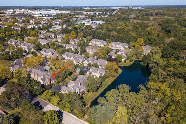 drone / aerial view featuring a water view and a residential view