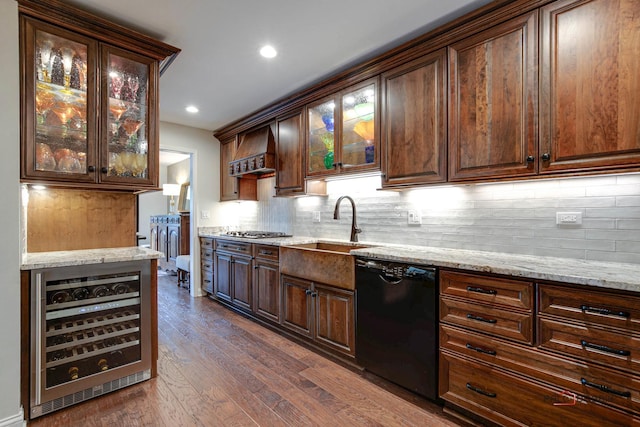 kitchen with light stone counters, wine cooler, dark wood finished floors, premium range hood, and dishwasher