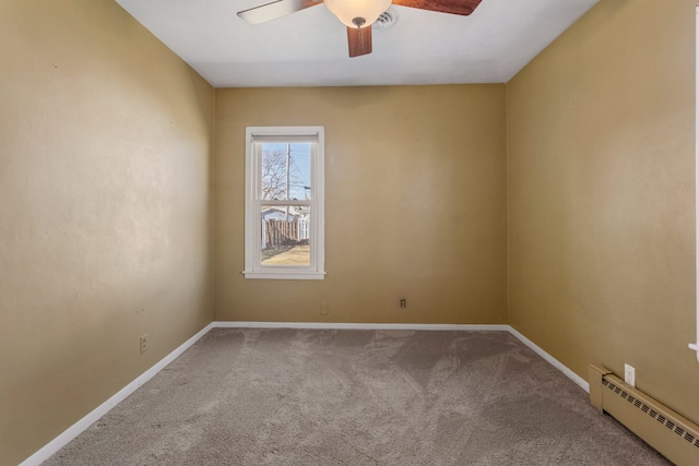 empty room featuring a baseboard radiator, carpet flooring, ceiling fan, and baseboards