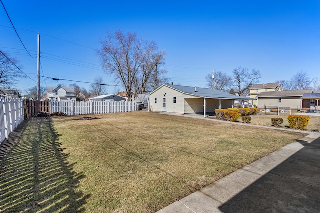 view of yard featuring a residential view, a fenced backyard, and a patio