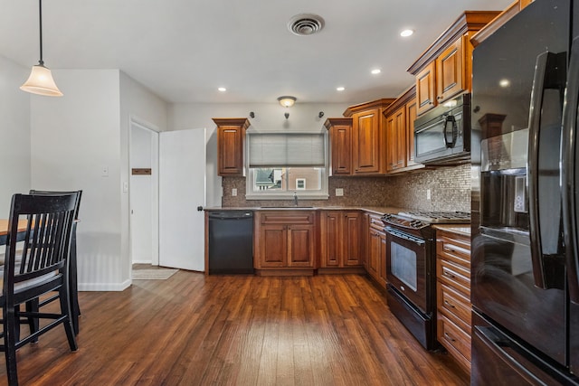 kitchen with visible vents, brown cabinetry, decorative backsplash, dark wood-style floors, and black appliances