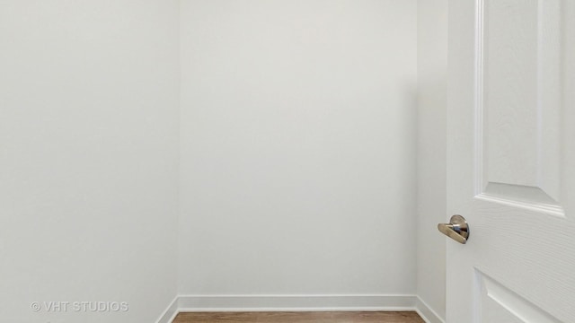 interior details featuring baseboards and wood finished floors