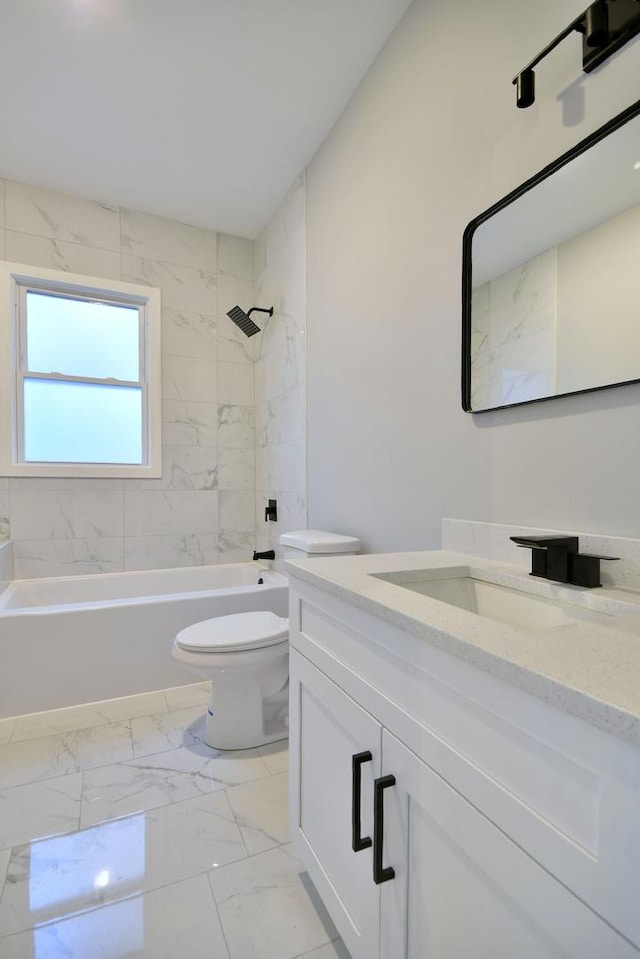 full bath with marble finish floor, shower / bathing tub combination, vanity, and toilet