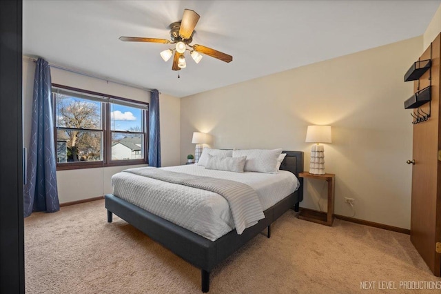 bedroom featuring carpet floors, a ceiling fan, and baseboards