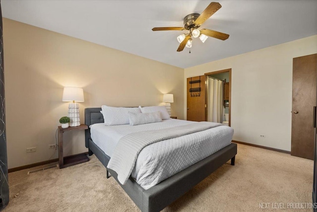 bedroom with baseboards, a ceiling fan, visible vents, and light colored carpet