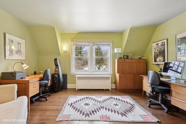 home office with radiator heating unit and wood finished floors