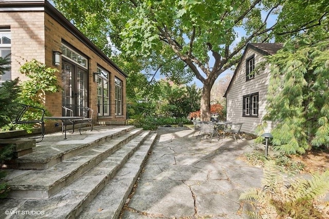 view of patio / terrace featuring french doors and outdoor dining space