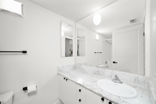 full bathroom featuring toilet, bathing tub / shower combination, visible vents, and vanity