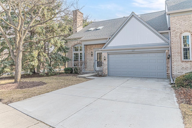 view of front of house featuring brick siding, an attached garage, concrete driveway, and roof with shingles