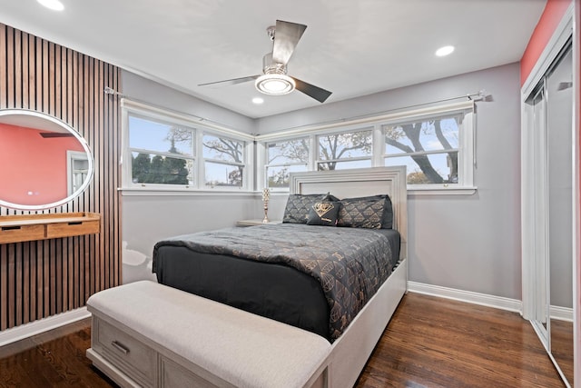 bedroom with a ceiling fan, recessed lighting, dark wood-style flooring, and baseboards