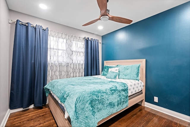 bedroom featuring ceiling fan, baseboards, wood finished floors, and recessed lighting