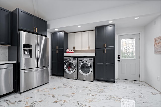 kitchen featuring decorative backsplash, washing machine and clothes dryer, marble finish floor, stainless steel appliances, and recessed lighting