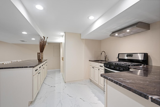 kitchen with marble finish floor, recessed lighting, visible vents, gas stove, and wall chimney exhaust hood