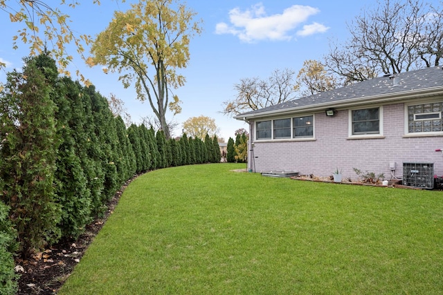 view of yard with central AC unit