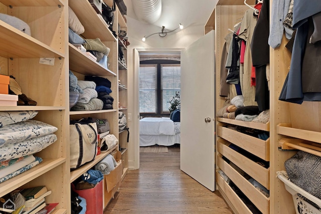 spacious closet with wood finished floors