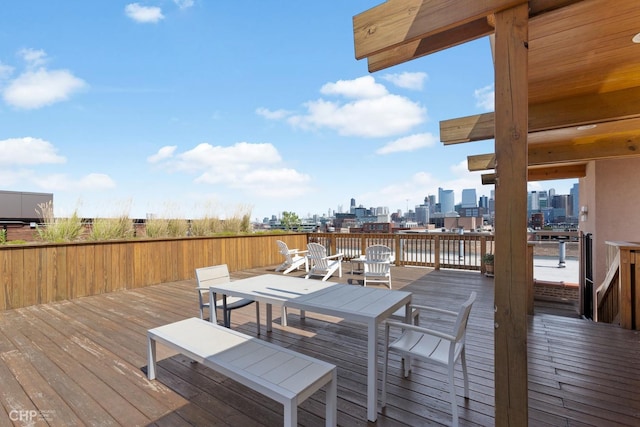 wooden deck featuring a view of city