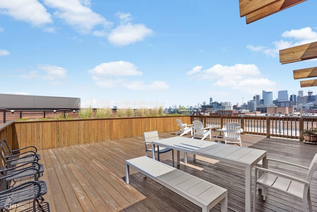 wooden terrace featuring a view of city