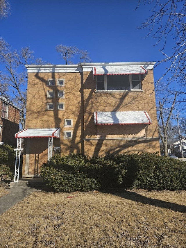 exterior space with brick siding