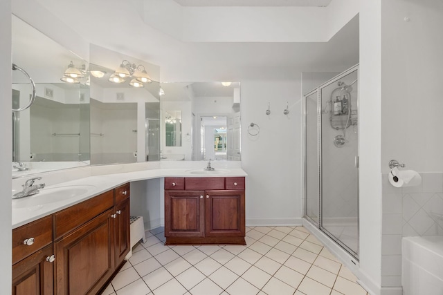 full bathroom with tile patterned flooring, a shower stall, and vanity