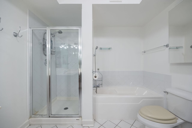 bathroom with a bath, a shower stall, toilet, and tile patterned floors