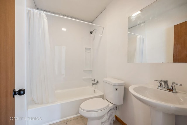 full bathroom featuring tile patterned flooring, a sink, shower / tub combo, and toilet