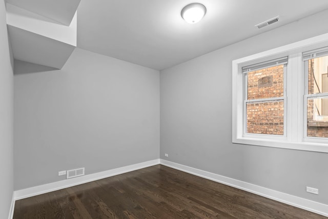 empty room with baseboards, visible vents, and a healthy amount of sunlight