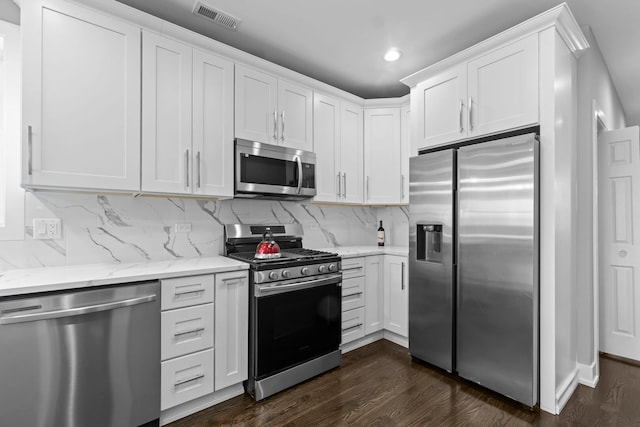 kitchen with white cabinetry and stainless steel appliances