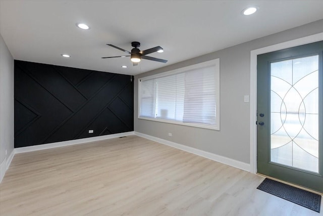 entryway featuring baseboards, recessed lighting, a ceiling fan, and light wood-style floors